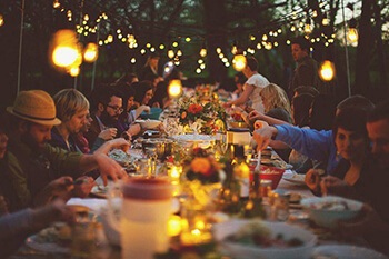 Group of People Feasting at a Large Table in Westbrook